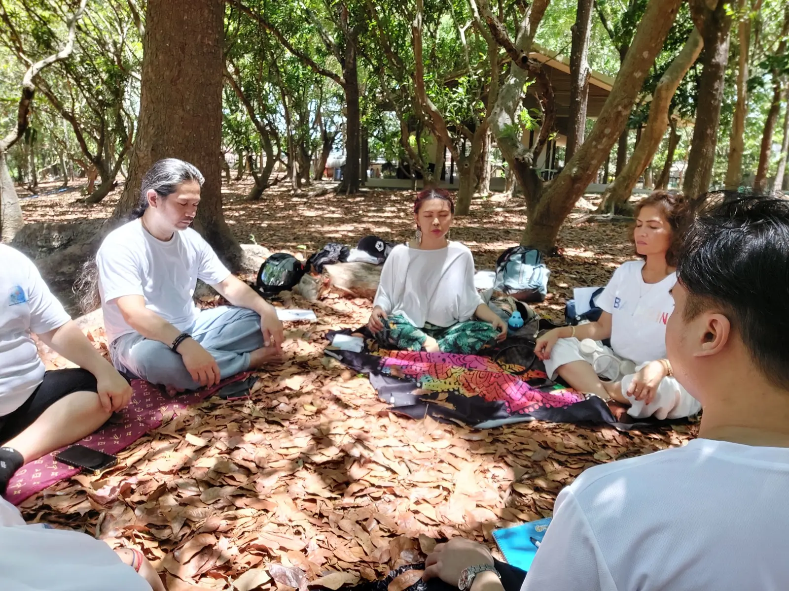 Students seated in a quiet Reiki practice circle